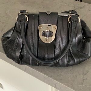 Alexander M Queen Black leather top handle Bag